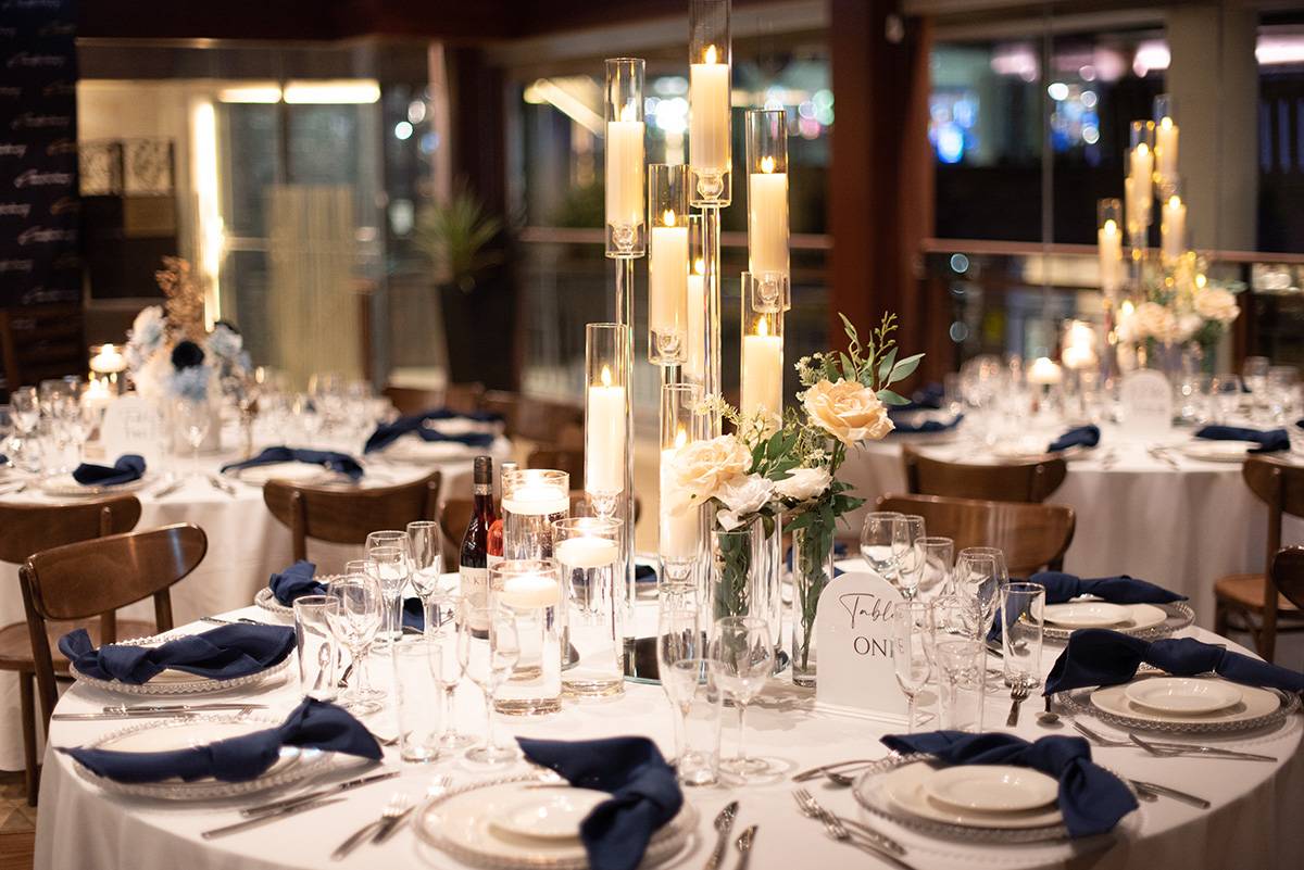 Upclose view of example table decorations with lots of candles as the centrepiece