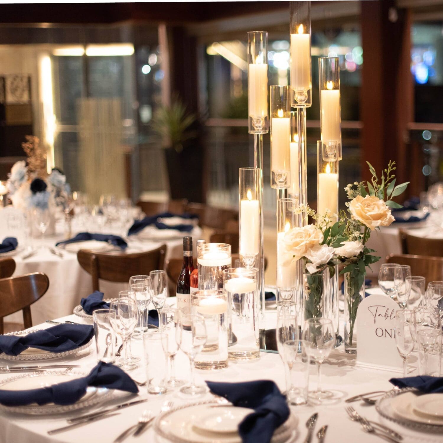 Upclose view of example table decorations with lots of candles as the centrepiece