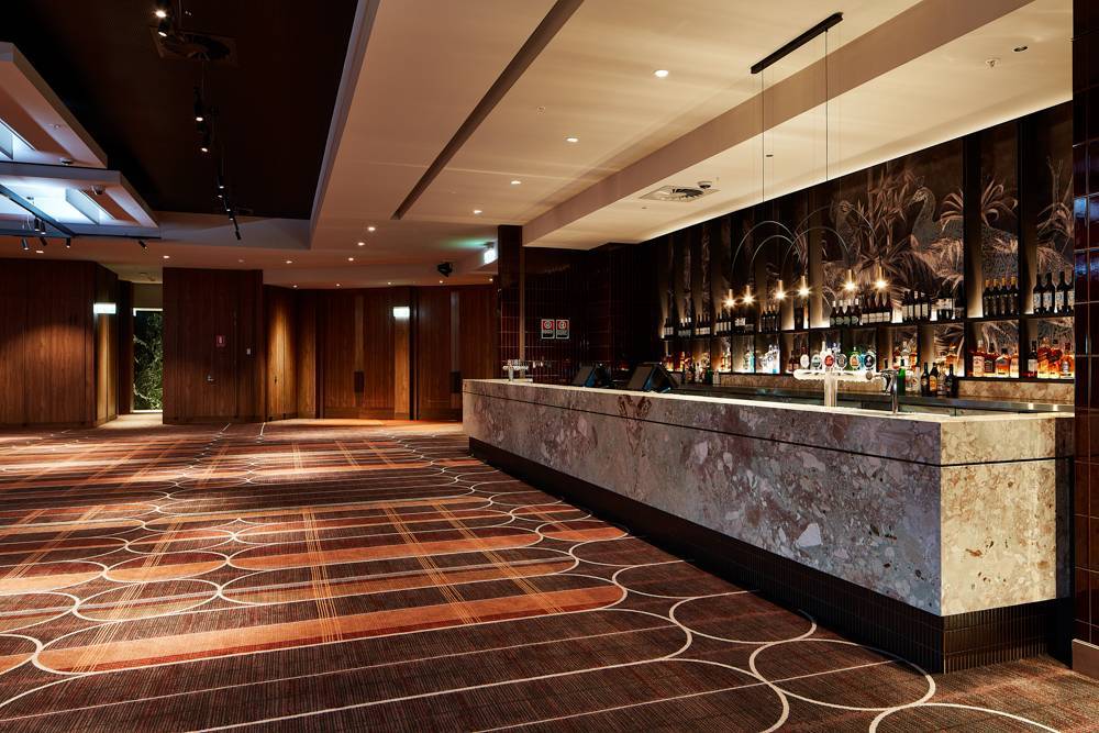 Wide angle shot of the new Showroom showing the bar, and front door