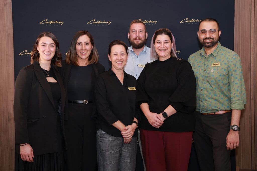 canterbury staff members smiling into the camera